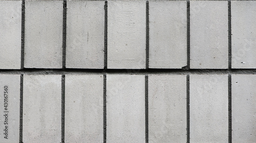 wall with gray tiles, closeup. Gray stone wall close up, photo texture, structure. old tiles, construction, repair. flat background for text. Masonry Stone Wall. Background Structure - Wallpaper