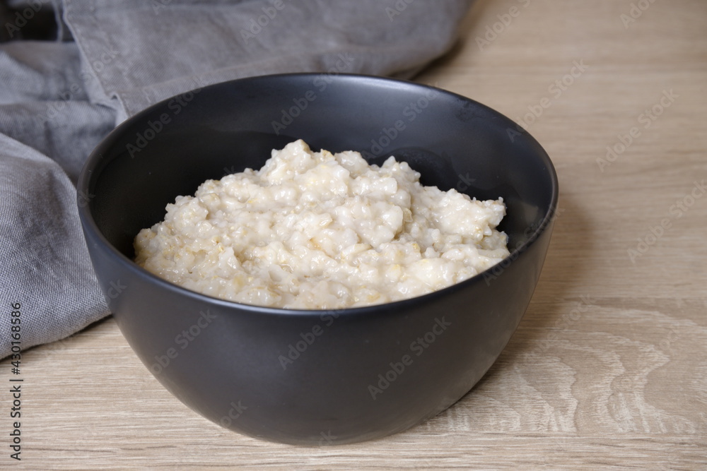 Oatmeal. Oatmeal in a black plate. Cooking. Food. Oatmeal. Oatmeal in a black plate. Cooking. Food.