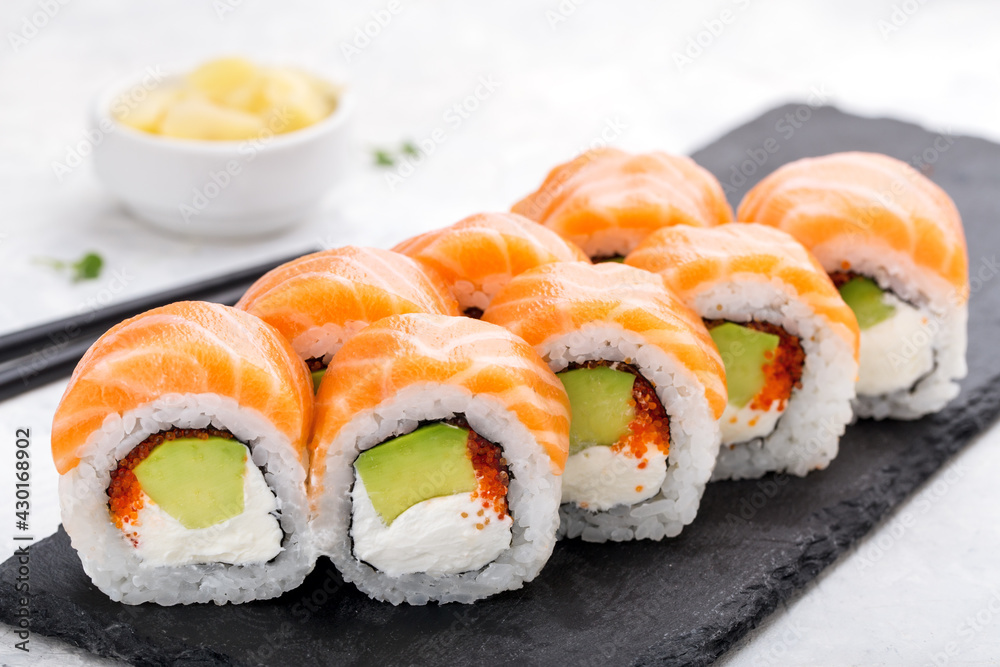 Sushi roll set with salmon, avocado and Philadelhia. Sushi menu. Japanese food. Sushi roll set with salmon, avocado and Philadelhia. Sushi menu. Japanese food.