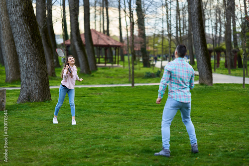 Couple playing badminton in the park