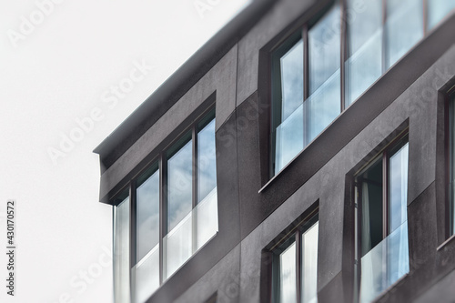 modern building fragment of the facade with glazing, blurred image
