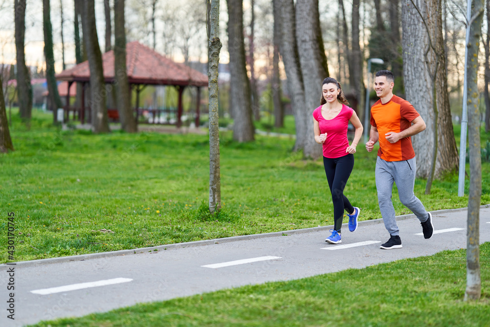 Young couple running in the park