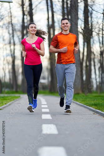 Young couple running in the park