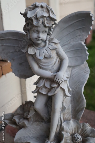 Angle stone statue close up face on front porch 