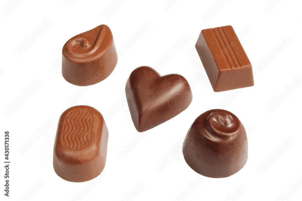 Five different shaped chocolate pralines isolated on white background Five different shaped chocolate pralines isolated on white background