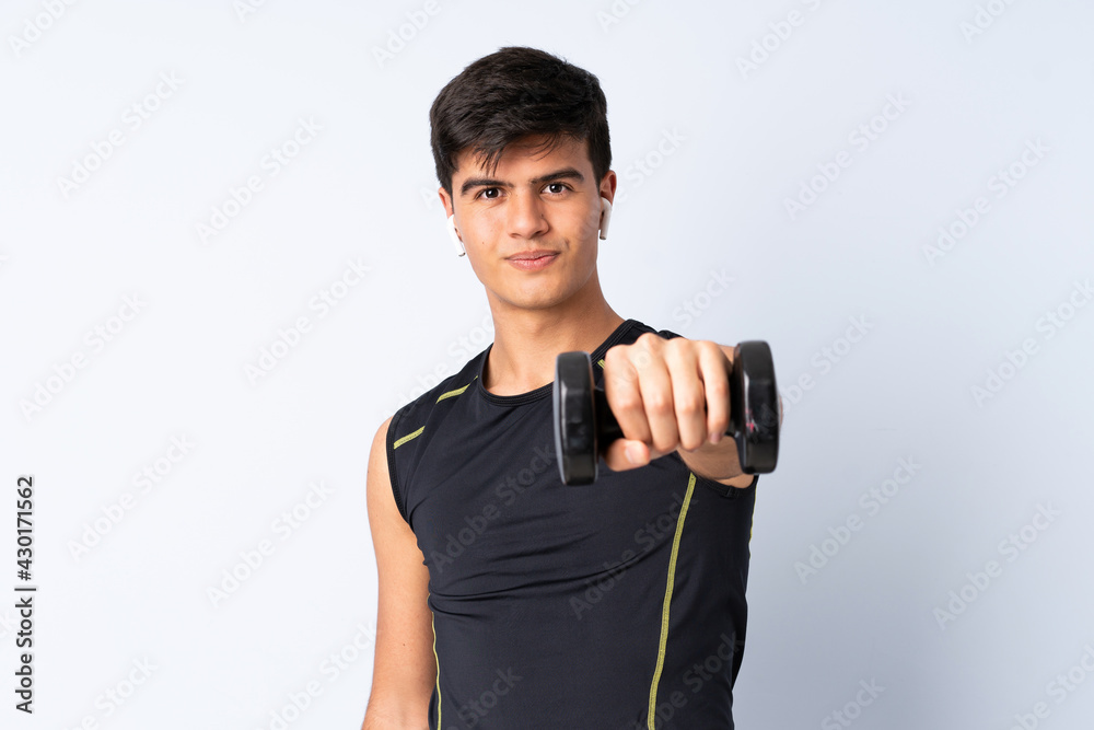 Sport man over isolated blue background making weightlifting Sport man over isolated blue background making weightlifting