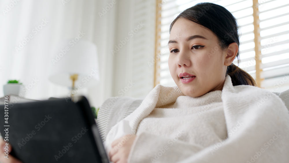 Young attractive beautiful asian female patient talk to doctor on cellphone videocall conference medical app in telehealth telemedicine online service hospital quarantine social distance at home. Young attractive beautiful asian female patient talk to doctor on cellphone videocall conference medical app in telehealth telemedicine online service hospital quarantine social distance at home.