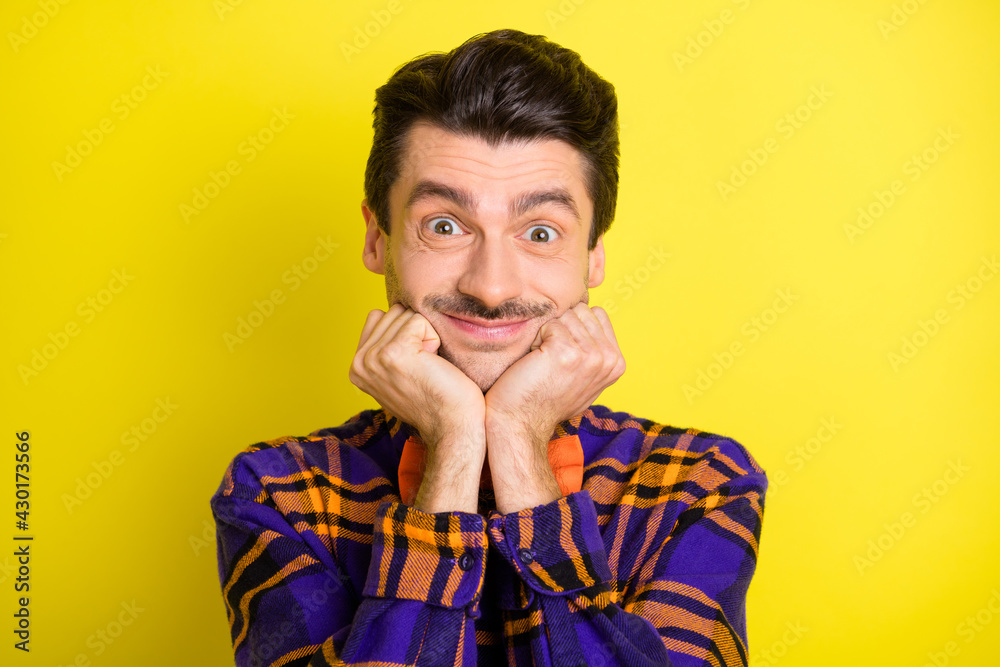 Photo of cute funny guy look camera fists cheeks wear bow tie checkered shirt isolated yellow color background Photo of cute funny guy look camera fists cheeks wear bow tie checkered shirt isolated yellow color background