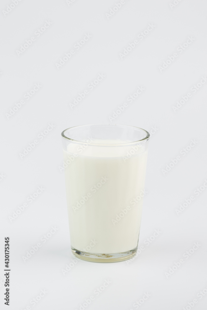 A glass of milk on a white background A glass of milk on a white background