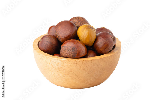 Roasted chestnuts in wooden bowl isolated on white background with Clipping Path.
