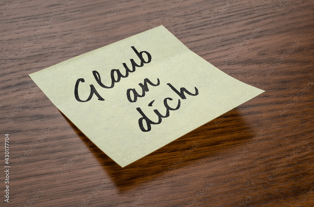 Sticky note with the text Believe in you in german - Glaub an dich Sticky note with the text Believe in you in german - Glaub an dich