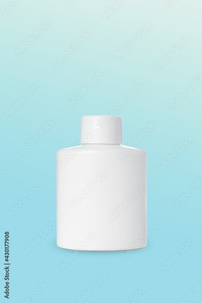 empty white plastic bottle for cosmetics on blue background. Mockup empty white plastic bottle for cosmetics on blue background. Mockup