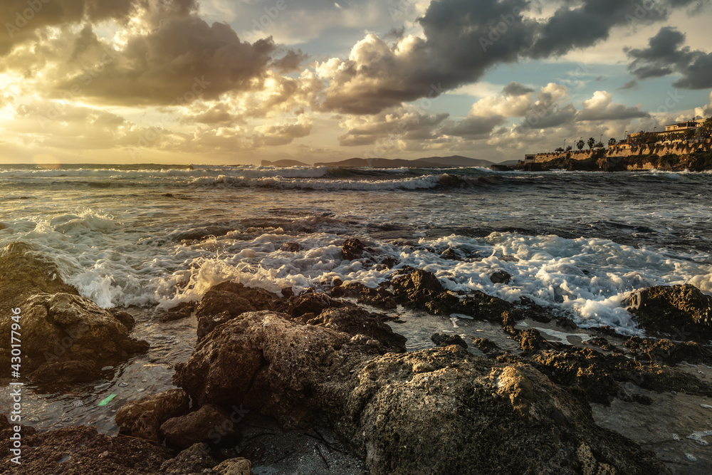 Dramatic sky over Alghero rocky shore at sunset Dramatic sky over Alghero rocky shore at sunset