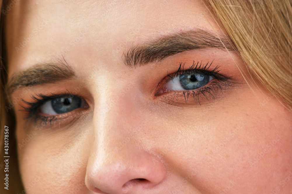 Obraz premium Close up sexy young blue-eyed female sight.
