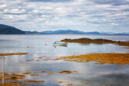 Norway. Landscape with fjord, boat and mountains on a summer day