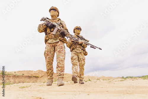 Photography Equipped and armed special forces soldiers with rifles during army operation