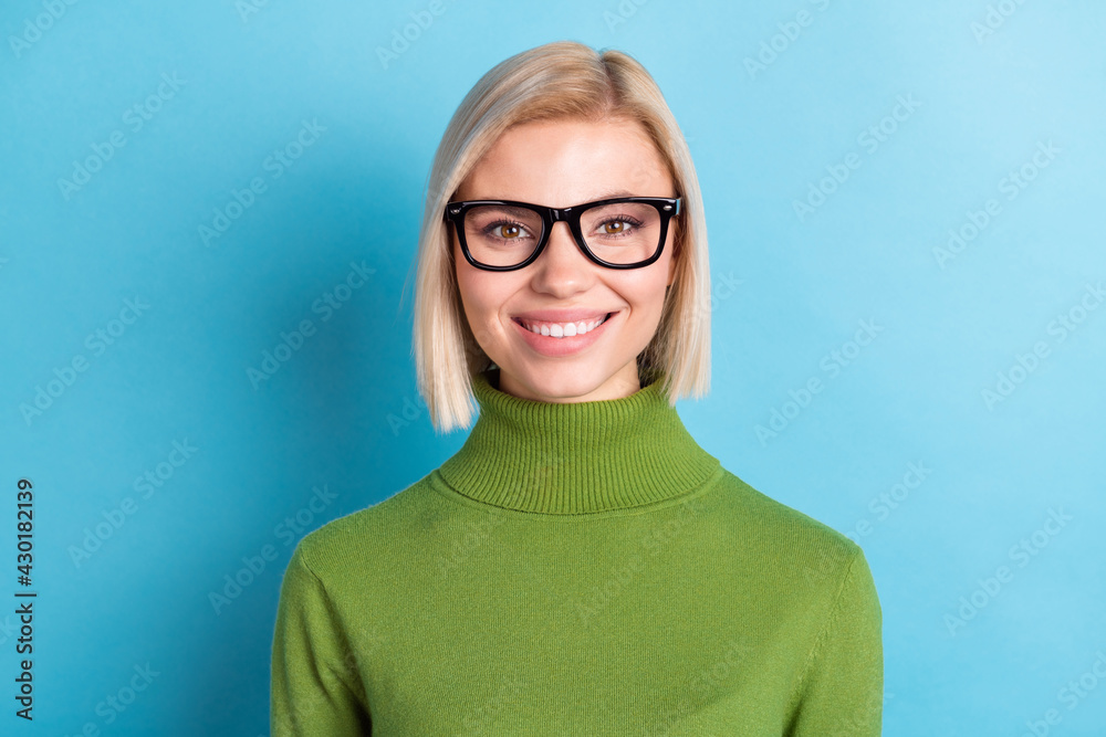Photo of young charming pretty smiling girl in glasses perfect teeth stomatology treatment isolated on blue color background Photo of young charming pretty smiling girl in glasses perfect teeth stomatology treatment isolated on blue color background