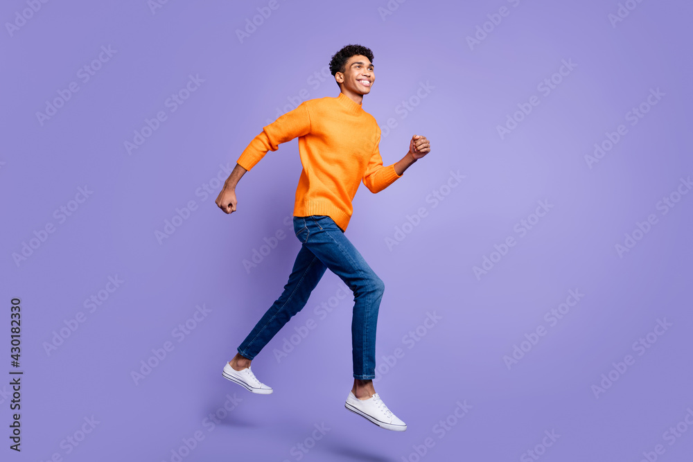 Full length profile side photo of afro american man go jump empty space dream sale isolated on violet color background