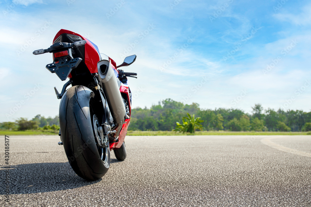 Obraz premium motorcycle parking on the road riding with soft-focus and over light in the background