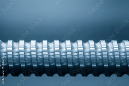 The close-up scene of linear lead ball screw spare part . The hi-precision CNC machine manufacturing concept.