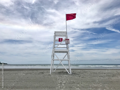 Red Flag and bay watch tower on Easton Beach, Newport, Rhode Island, USA