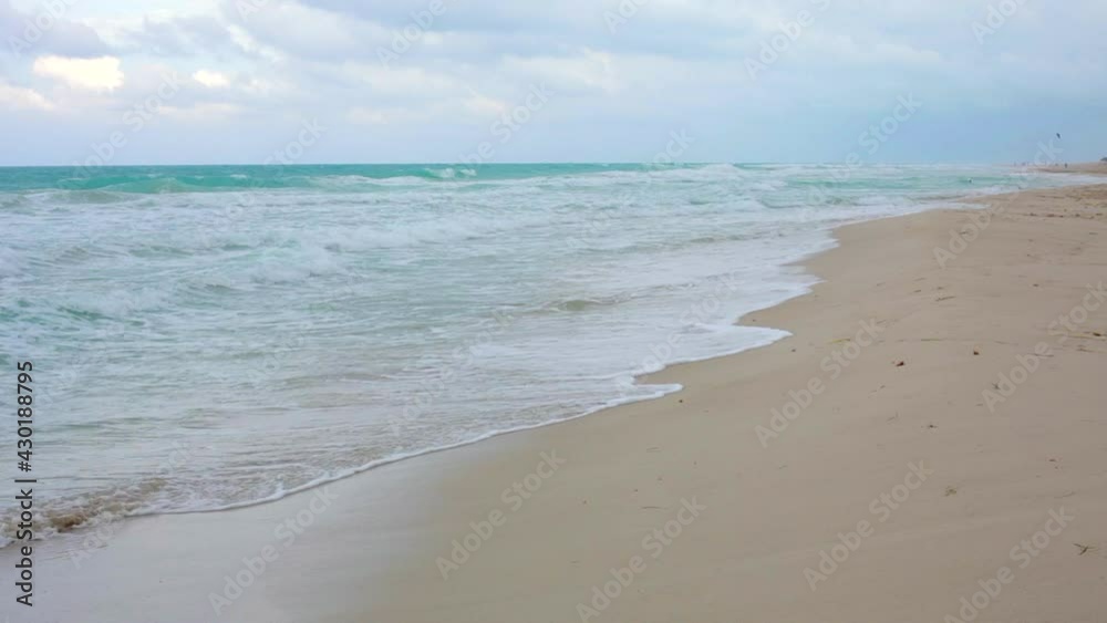 Varadero Beach in Cuba. Beautiful Ocean Waves Crashing on the Shore during the Day. Varadero Beach in Cuba. Beautiful Ocean Waves Crashing on the Shore during the Day.