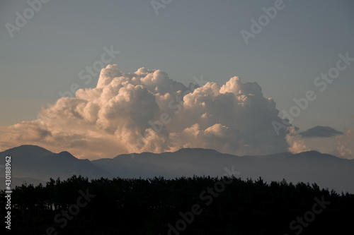 morning sky with large white clouds. Beautiful view of cloudscape and mountains