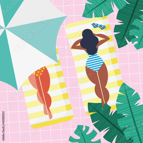 girls tanning in pool