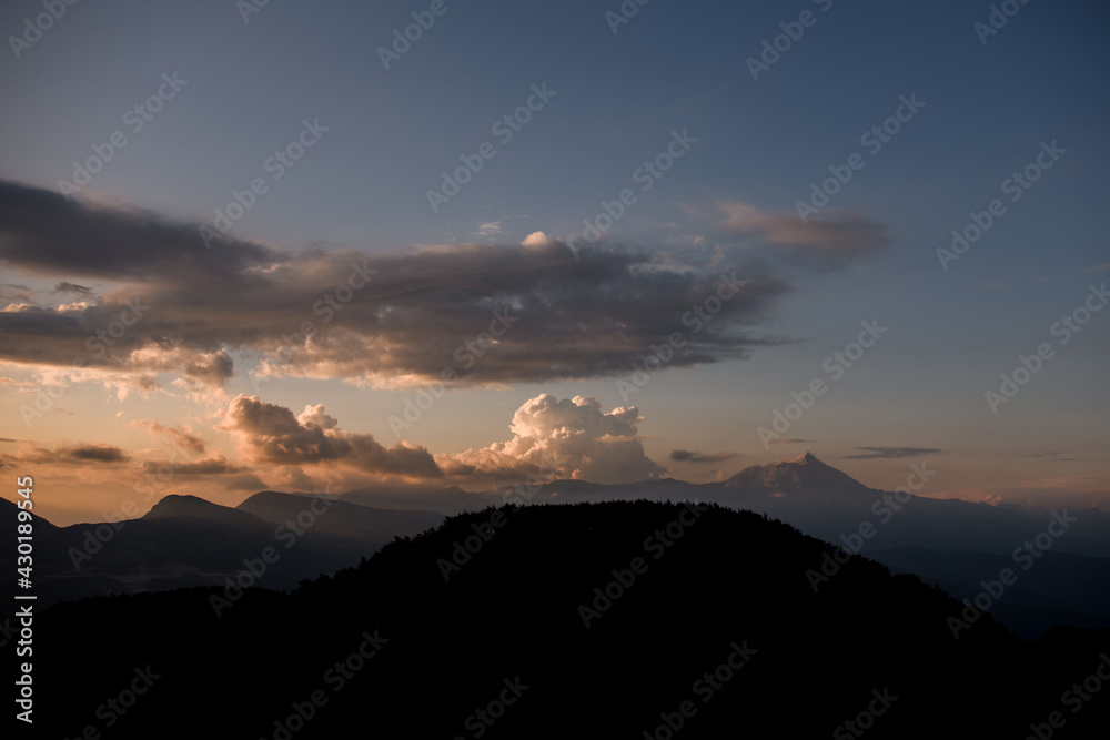 Great view of sky with big clouds over mountain landscape. Beauty in nature.