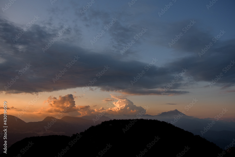 magnificent view of sky with big colorful clouds over mountain silhouette. Beauty in nature. magnificent view of sky with big colorful clouds over mountain silhouette. Beauty in nature.