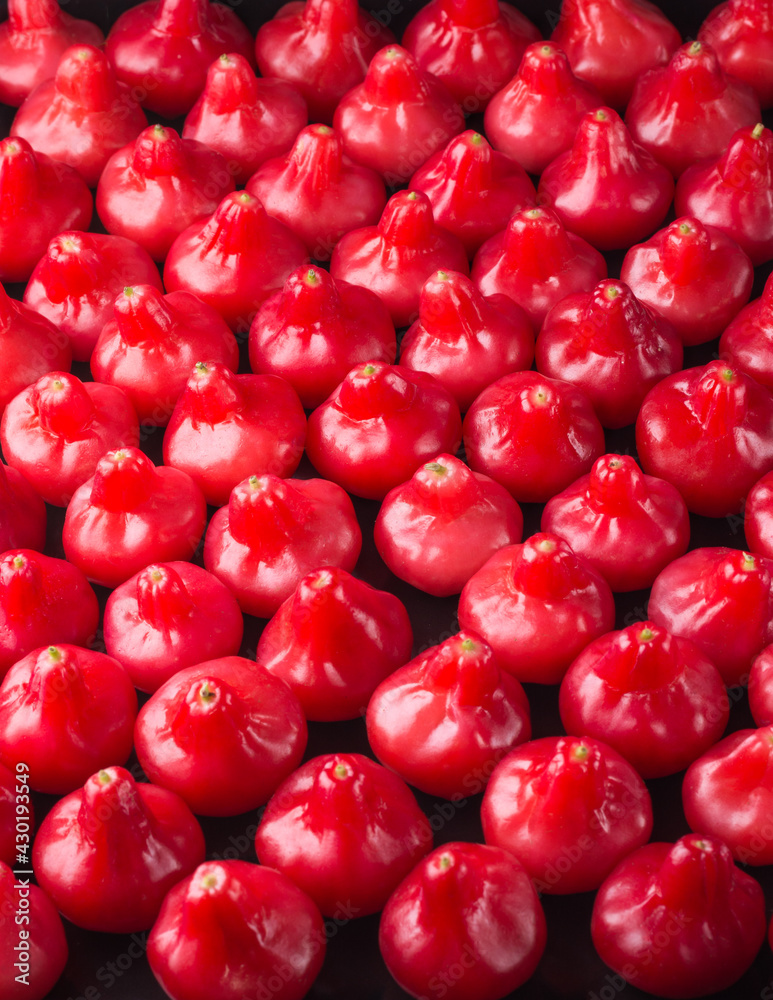 jambu or rose apple, bell-like shape fruit also called bell fruit or wax apple, shot in full frame,sri lanka juicy fruits texture, background