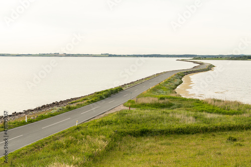 Aerial view of long road and beautiful shore by the sea