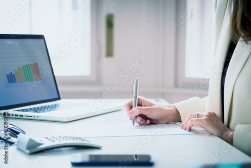 Financial advisor businesswoman using laptop while working at the office