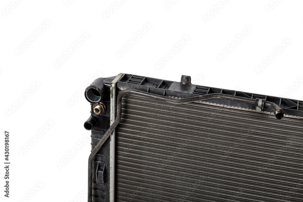 Fototapeta premium The old cooling radiator is a metal heat exchanger inside filled with antifreeze. Repair in the workshop. Parts Catalog.