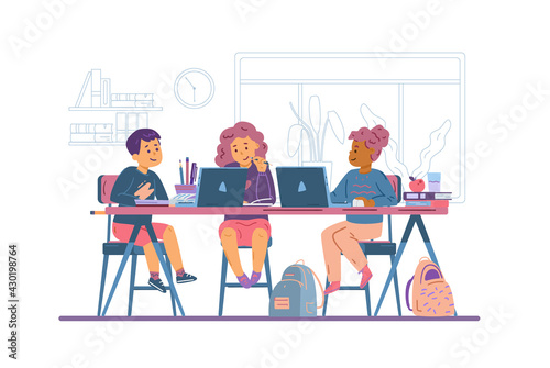 Group of children study online sitting at desk with laptop computers and books