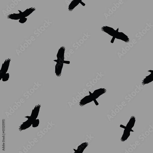Flock of crows flying in the dark grey sky seamless pattern seamless pattern background