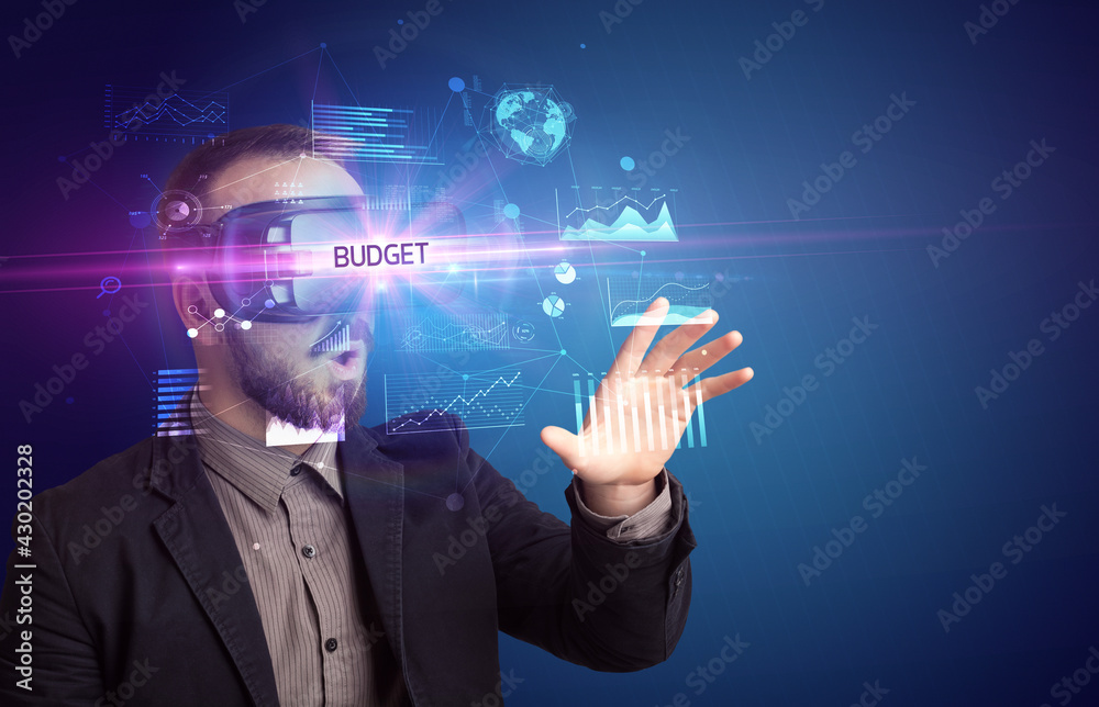 Businessman looking through Virtual Reality glasses Businessman looking through Virtual Reality glasses