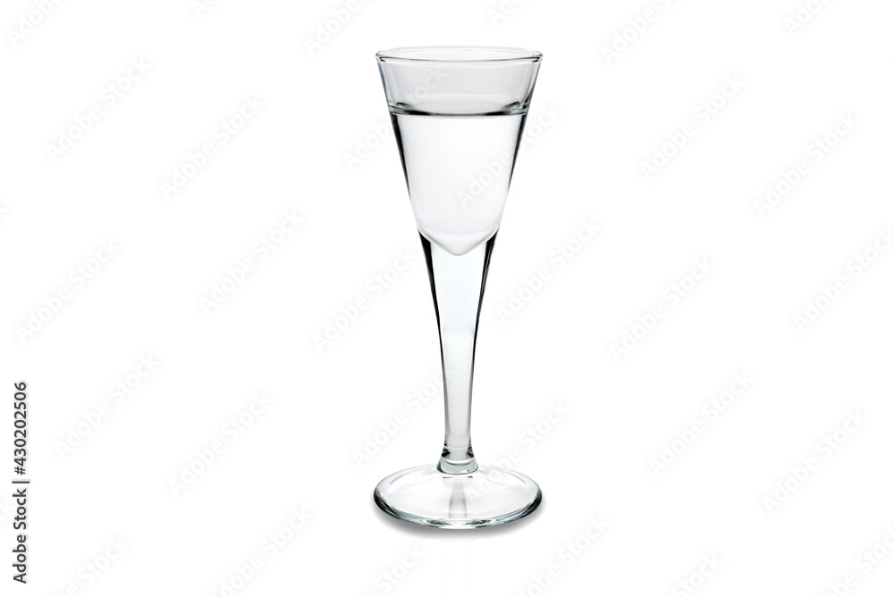 Obraz premium grappa or vodka in a goblet shot glass isolated on white