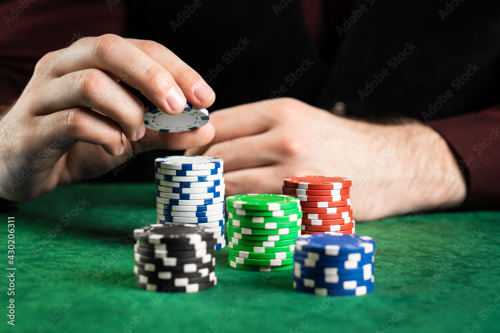 A poker player can't decide how many chips to take. A poker player can't decide how many chips to take.