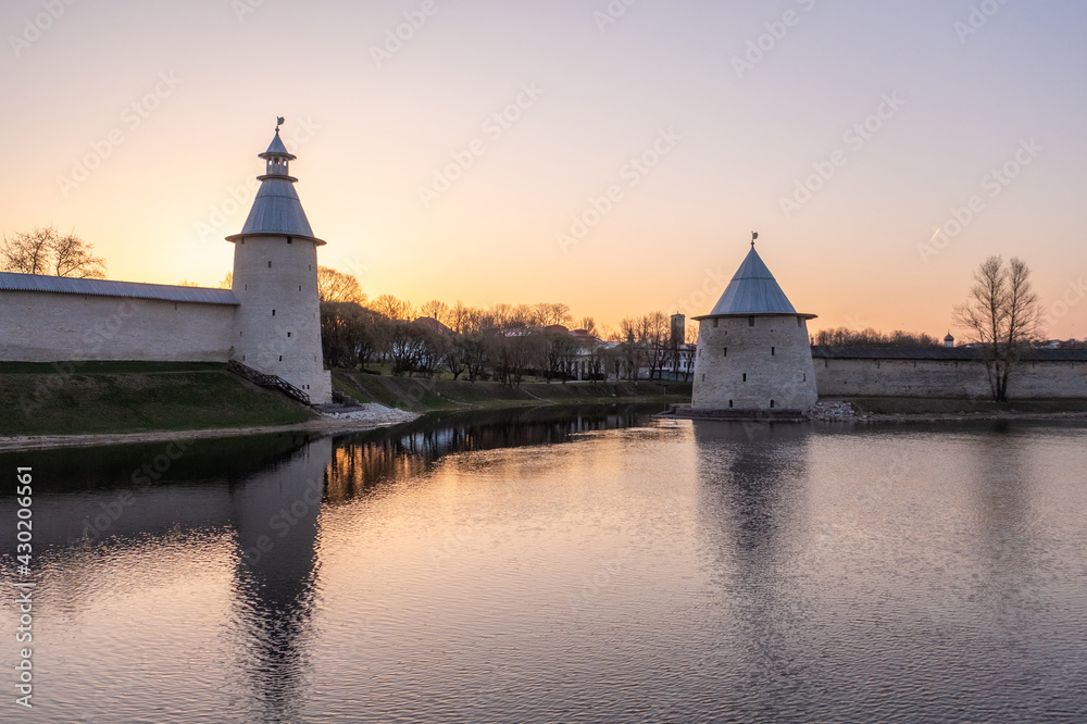 The main attractions of Pskov, a Russian city, a tourist center. Pskov Kremlin, Velikaya river. Sunrise.