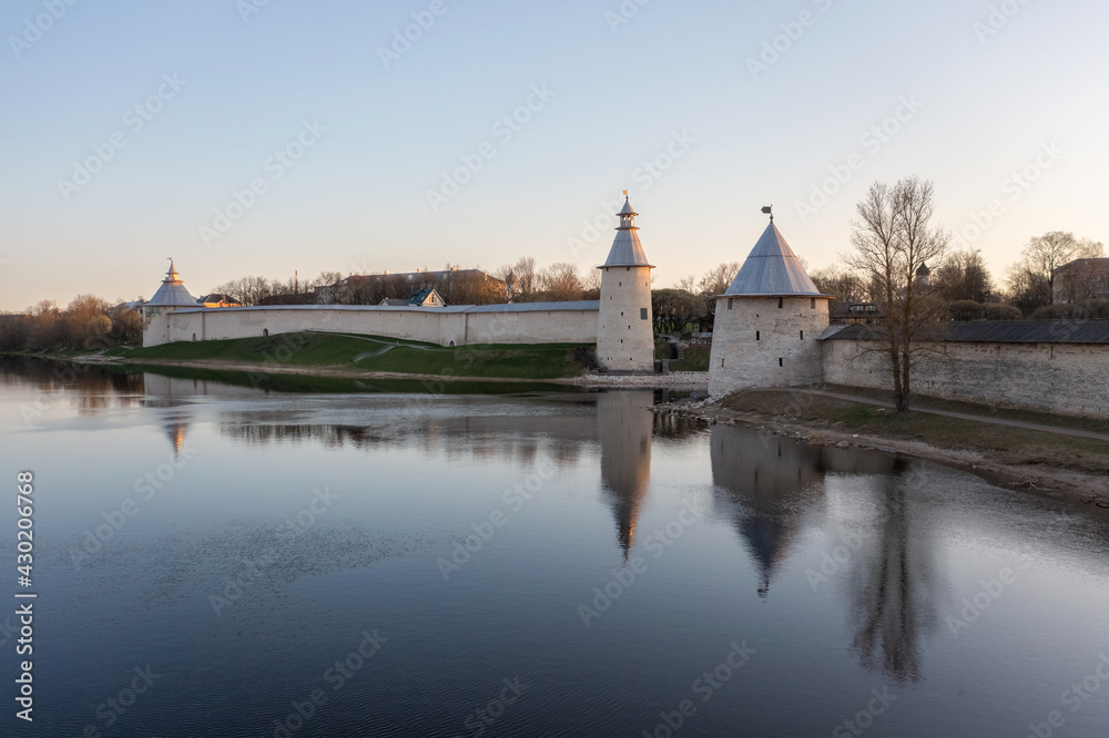The main attractions of Pskov, a Russian city, a tourist center. Pskov Kremlin, Velikaya river. Sunrise. The main attractions of Pskov, a Russian city, a tourist center. Pskov Kremlin, Velikaya river. Sunrise.