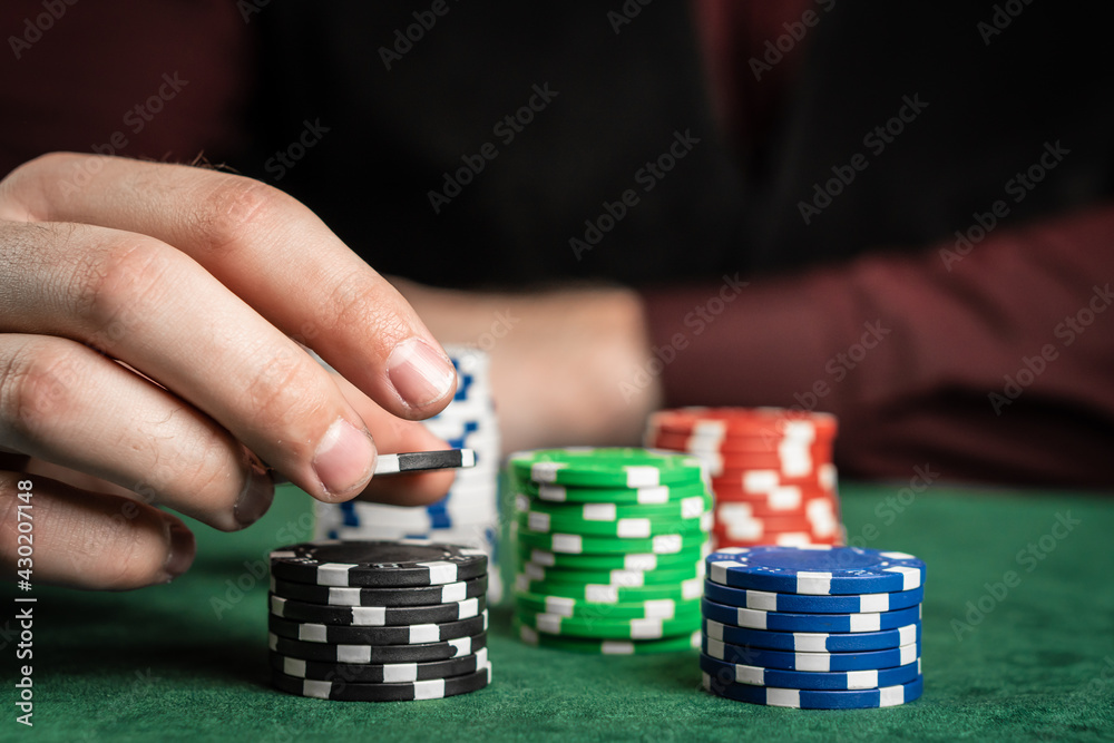A poker player can't decide how many chips to take. A poker player can't decide how many chips to take.