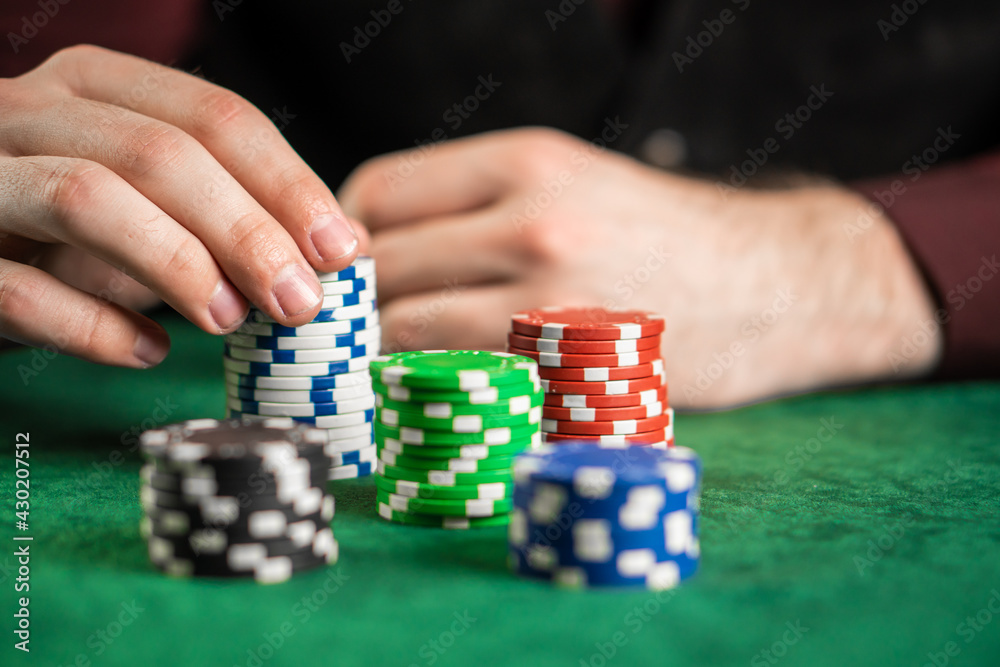 A poker player can't decide how many chips to take. A poker player can't decide how many chips to take.