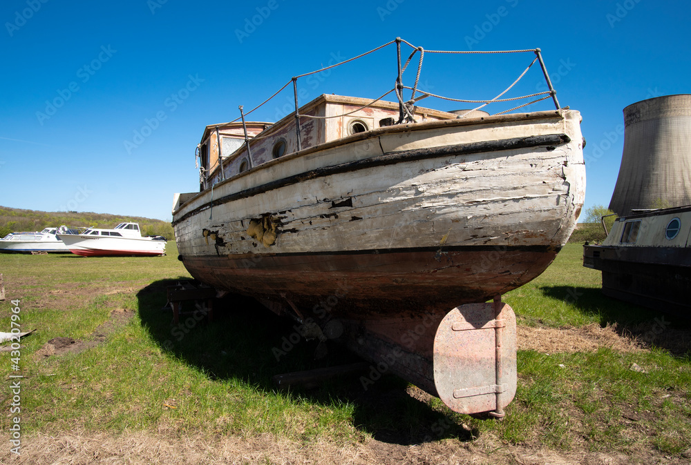 Rudder on an obsolete boat in a salvage yard