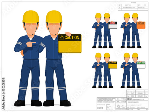Two industrial workers are presenting warning sign on white background