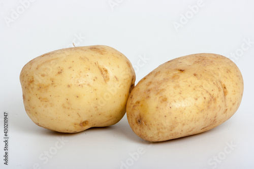 two baking potatoes isolated on white