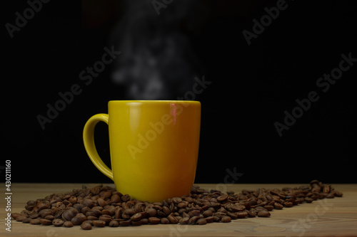preparing a cup of filter coffee on wooden table. Black background