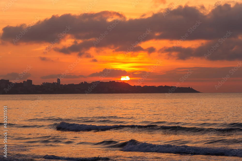
The sun rising at dawn from Alicante Beach. Spain 