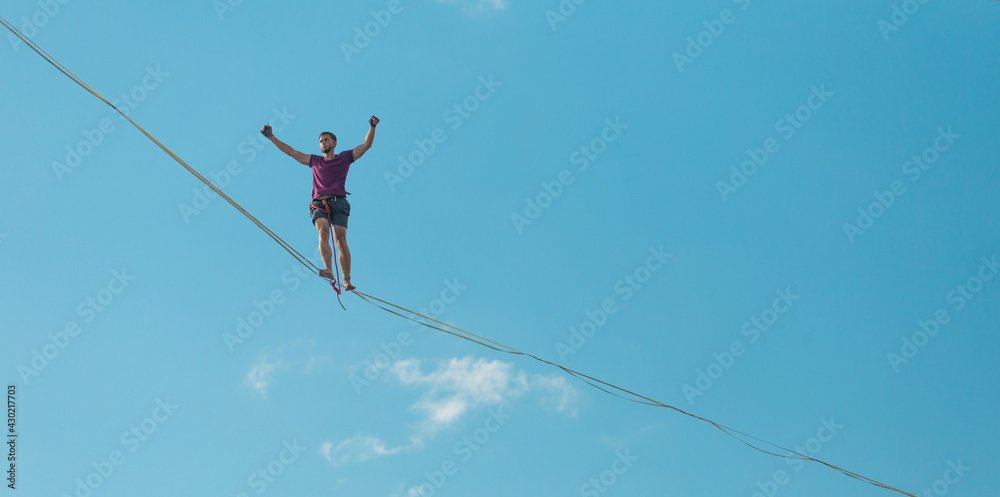 Highliner on the background of blue sky. Highliner on the background of blue sky.