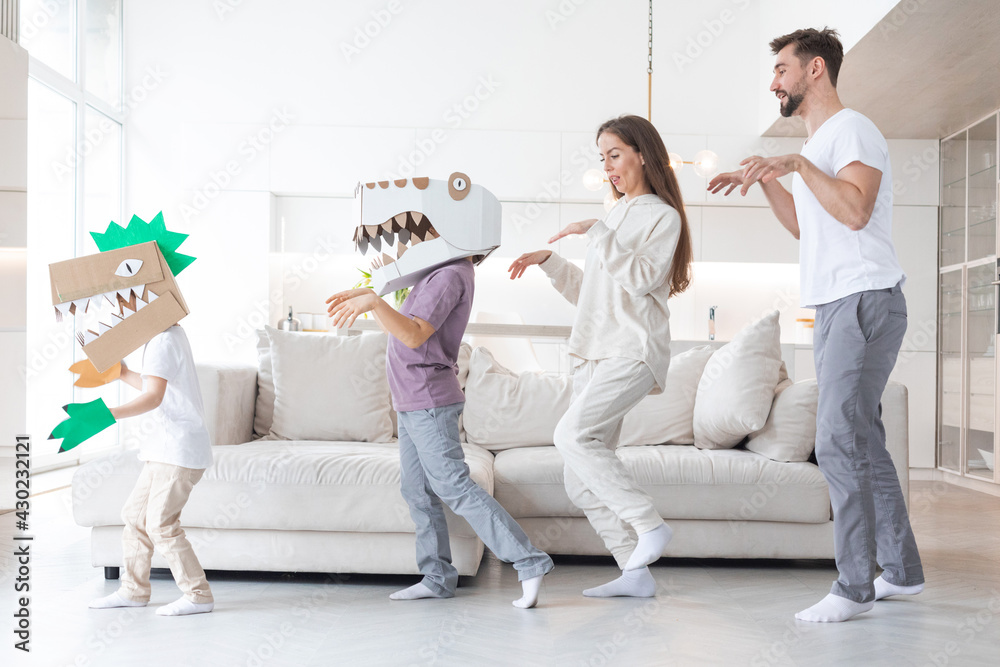 Family playing dinosaurs at home Family playing dinosaurs at home